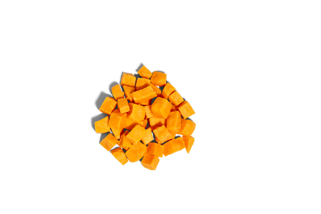 Spot & Tango Cheese Bites in a pile, 100% cheddar cheese for dogs with no additives or preservatives